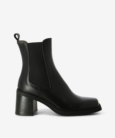 Black leather Chelsea boots. A slip-on style and features elastic gussets with a pull tab, platform sole, block heel and a square toe.