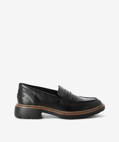 Black leather loafers by Django & Juliette. It is a slip on style that features a contrasting midsole and a round toe.