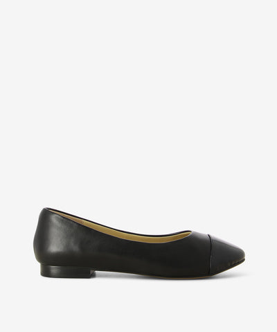 Black leather flats by 2 Baia Vista. It is a slip on style and features a contrasting patent leather toe, low block heel, and a round toe.