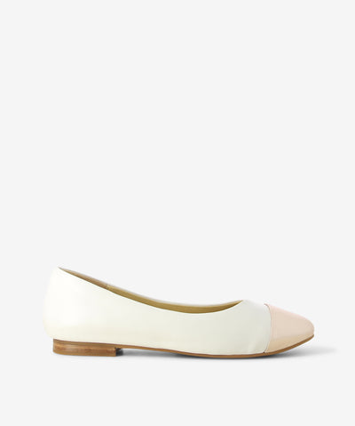 White leather flats by 2 Baia Vista. It is a slip on style and features a contrasting metallic leather toe, low block heel, and a round toe.