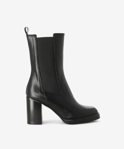 Black high leather ankle boots with features elasticated gussets, a block heel and a soft square toe.