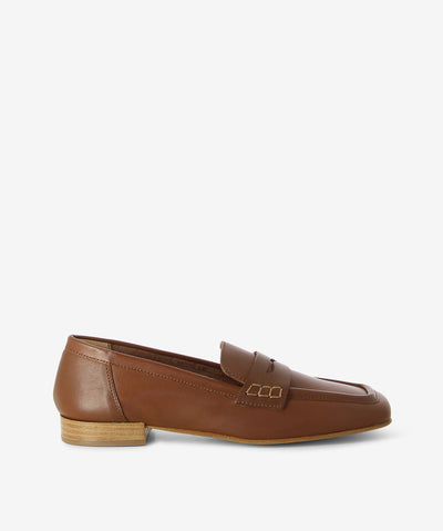 Brown leather loafers with a slip-on style and features a low stacked heel with a square toe.