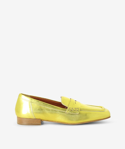 Yellow metallic leather loafers with a slip-on style and features a low stacked heel and a square toe.