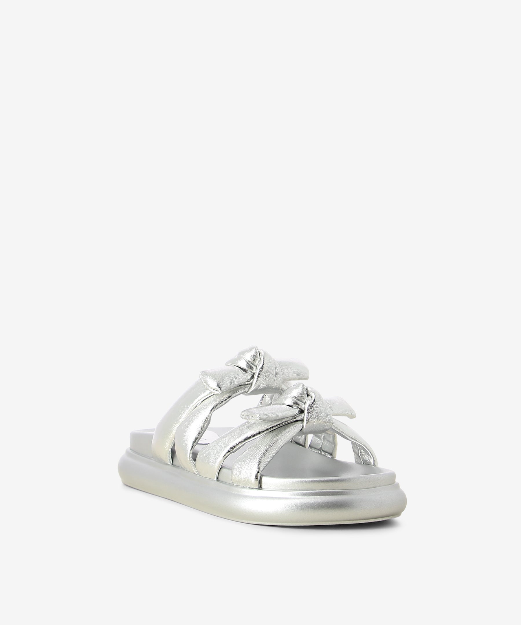 Silver metallic leather flats by 2 Baia Vista. It is a slip on style and features knotted upper straps, a raised padded sole, and a round toe.