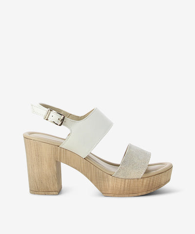 White platform leather sandals by Origini Studio. It features ankle buckle strap with an adjustable pin-buckle fixture, chunky platform sole, and almond toe.