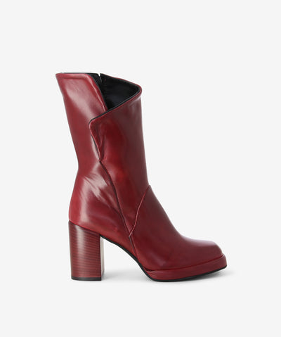 Red leather mid-calf boots with an inner zipper fastening and features an angle shaft upper with a block heel and a soft square toe.