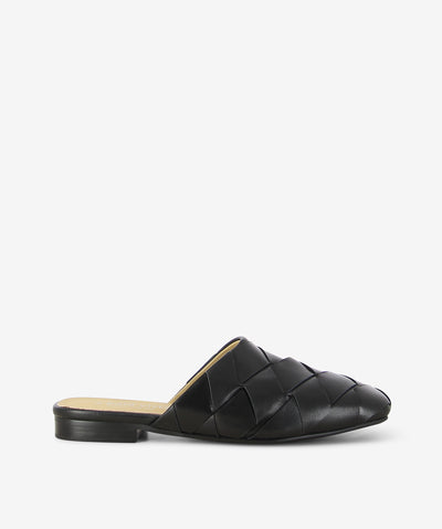 Black leather mules by 2 Baia Vista. It is a slip-on style with a breathable interwoven upper, a low block heel, and a soft square toe.