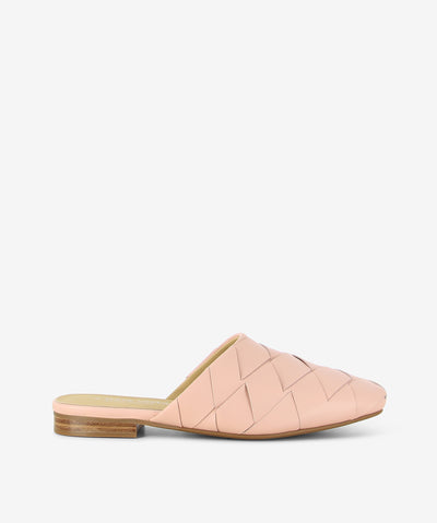 Nude leather mules by 2 Baia Vista. It is a slip-on style with a breathable interwoven upper, a low block heel, and a soft square toe.