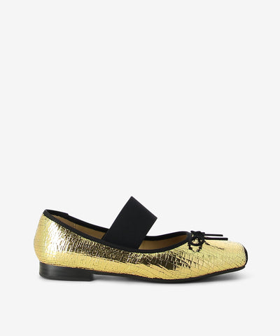 Gold crackle metallic leather flats by 2 Baia Vista. It is a slip on style and features an elastic upper strap, bow detail, and a contrasting square toe.