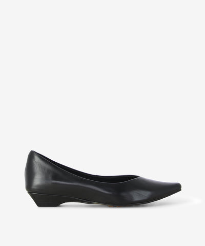 Elevate your everyday look with the Cassandra flats by 2 Baia Vista. Crafted in sleek black leather, this timeless style features a flattering low wedge heel and an elegant, pointed toe for a polished finish.