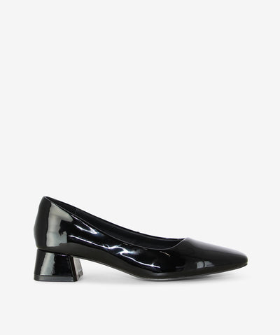 Polished and versatile, the Court heels by Martini Marco are your go-to for timeless sophistication. Crafted in glossy black patent leather, this style is defined by its sleek square toe and a modern mid-block heel for comfort that lasts all day. From office hours to after-dark occasions, the Court is an effortless staple that elevates every outfit with understated elegance.