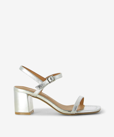 Meet Daisy by 2 Baia Vista your go-to heel with a modern essential—crafted in metallic silver leather and finished with a buttery-soft nappa leather insole for elevated comfort. Slim toe strap and adjustable ankle buckle fastening, slingback silhouette for a modern, breathable fit, sculptural block heel for statement stability and square open toe.