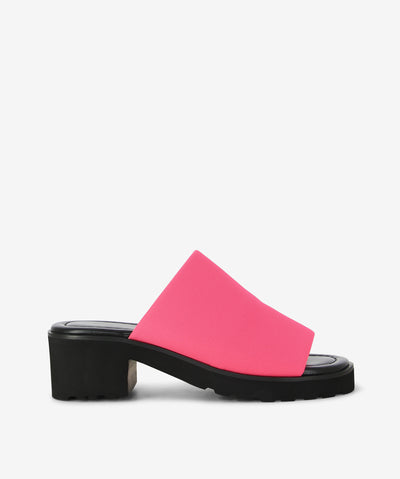 The legend is back! The Daj slides by 2 Baia Vista return in sleek Pink Fluro textile with a wide vamp, sturdy block heel, and chunky tread sole for a fresh, contemporary edge.
Crafted with breathable mesh stretch fabric, lambskin leather lining, and a feather-light Air EVA outsole, they deliver all-day comfort and effortless style—perfect for both relaxed tailoring and off-duty looks.