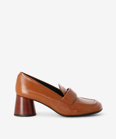Tan leather loafers by Halmanera. Is a slip-on style and features a mid a cylindrical heel and a soft square toe.