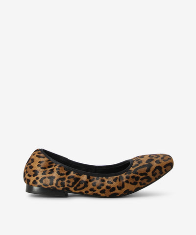 Unleash your inner feline with Danica by 2 Baia Vista. Textured leopard-print, pony upper in rich brown and black tones, Rounded toe for a soft, feminine finish, Black trim for contrast and polish, Low-profile heel for subtle lift and all-day comfort, Cushioned insole for effortless wear, Slip-on design for easy styling.