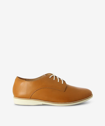 Tan leather derby shoes by Rollie. It has lace-up fastening and features a round toe.