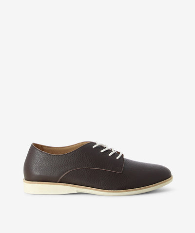 Brown leather derby shoes by Rollie. It has a lace-up fastening and features a grained upper, low contrast sole and an almond toe.