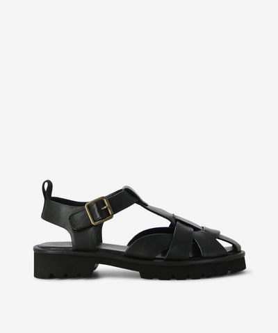 The Durango Black sandal by Bresley—a bold gladiator with a modern, utilitarian edge. Woven leather straps meet a chunky treaded sole and a softly rounded closed toe for a look that’s structured yet effortlessly cool. From city streets to coastal escapes, this sandal brings rugged polish to every outfit.
• Woven leather upper: Cage-like strap design with breathable coverage
• Closed round toe: Adds structure, protection, and a refined silhouette
• Chunky sole: Black tread with contrasting white midsole for 