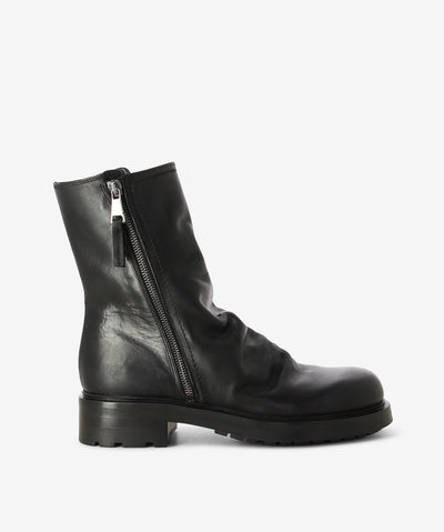 Black Italian leather ankle boots by Elena Iachi. It features double side zipper closures, a ruched upper, and a round toe.