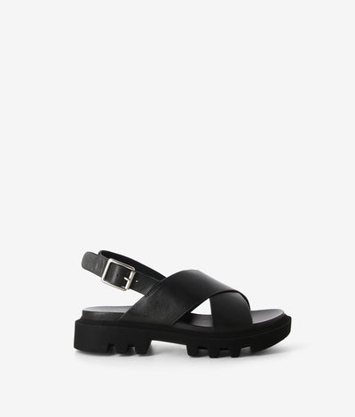 Black leather sandals by EOS. It has a slingback fastening and features crossover straps, a chunky tread sole and a round toe.