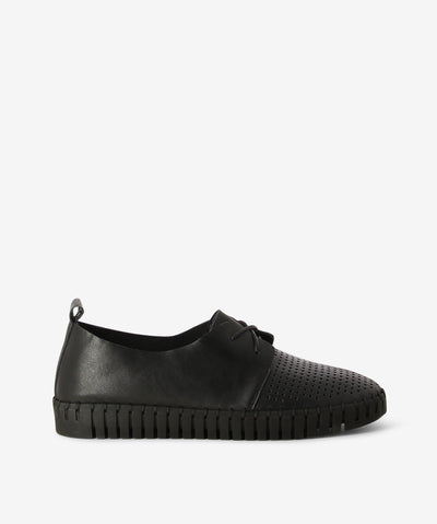 All black leather lace-up sneakers by Django & Juliette. It has a lace-up fastening and features a perforated upper, a ribbed sneaker sole and a soft round toe.  