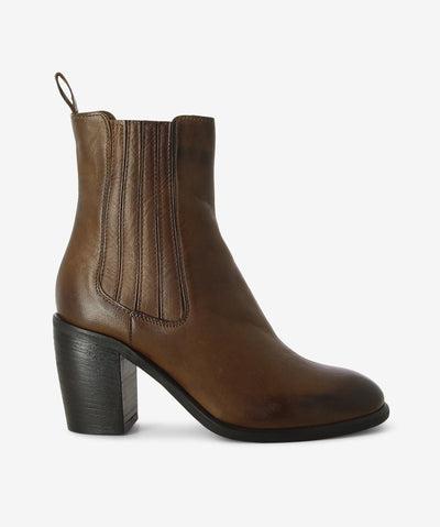 Brown leather ankle boots with a pull-on style with leather-covered elastic side gussets and features a block heel and an almond toe.