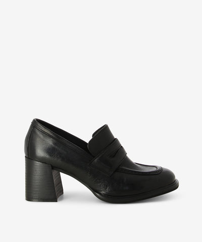 Black leather loafers with a slip-on style and features a block heel and a round toe.