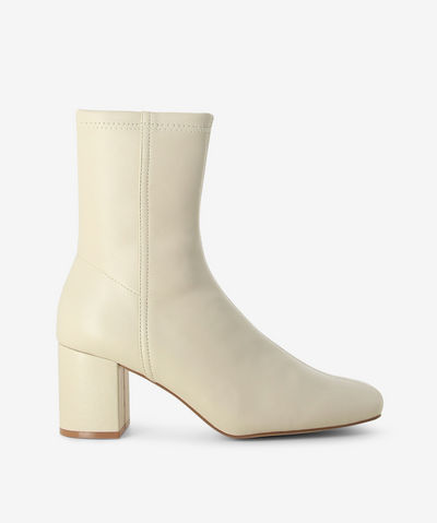 Beige fitted ankle boot with inner zip fastening, seaming detail, block heel and square toe by Siren.