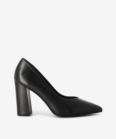 Black leather pumps by Bruno Premi. It is a slip on style and features a high block heel, and an enclosed pointed toe.