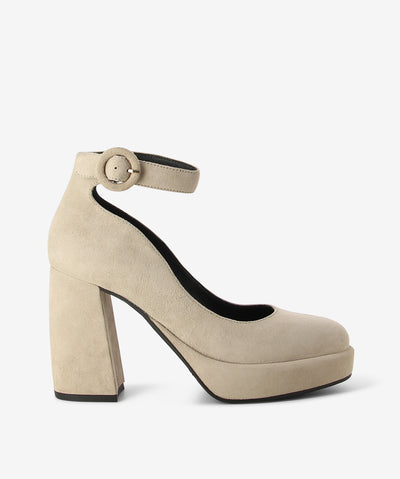 Beige suede pumps by Rotelli. It features a block heel and front platform, adjustable pin-buckle strap, and a round toe.