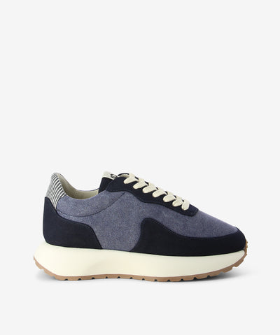 Navy sneakers by Good News London. It is a lace-up style that features a textured fabric upper, chunky platform sole, and a round toe.