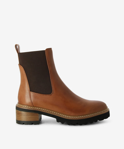 Brown cashmere leather Chelsea boots with features gore-elastic gussets, rear pull tabs, teamed with feather light treaded rubber outsoles and a round toe.