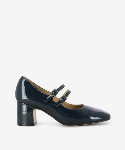 Meet MY2899 Navy Patent Mary Jane Block Heel by 2 Baia Vista—a timeless silhouette reimagined with sleek sophistication. This shoe blends retro charm with contemporary polish, making it a standout for both workday power moves and evening elegance.
Crafted in glossy Navy Patent leather, it features a softly squared toe and two slender straps across the instep, each secured with tonal round buckles. The mid-height block heel adds structure and comfort, while the clean lines keep it effortlessly refined.