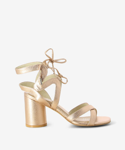 Nude metallic leather heel by Martini Marco. It has an ankle lace up fastening and features a crossed upper and a soft chisel toe.