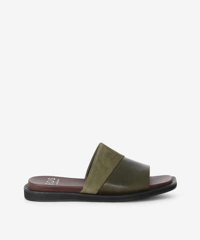Olive slides by EOS. It is a slip-on style with butter-soft Cashmere leather and Bel Pisolino suede detail that features full rand and suede fold over the collar, a flat sole, and a soft square toe. 