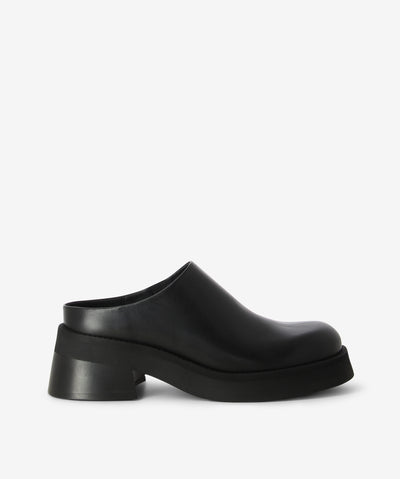 Black leather mule meets clog by Miista. A slip-on style and features with a discreet elastic gusset, a medium block heel and a round toe.
