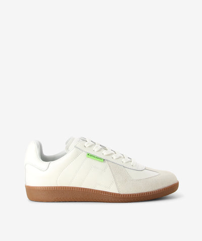 Panelled leather sneakers by Rollie. It is a lace-up style and features a gum sole, cushioned footbed, and a round toe.