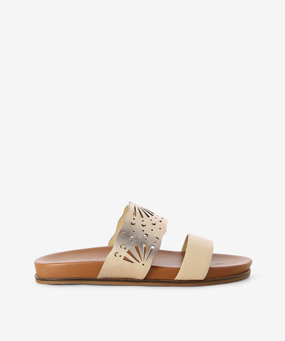 Nude metallic leather slide by Martini Marco. It is a slip on style and features a laser cut detailed upper strap, molded footbed, and a round toe.