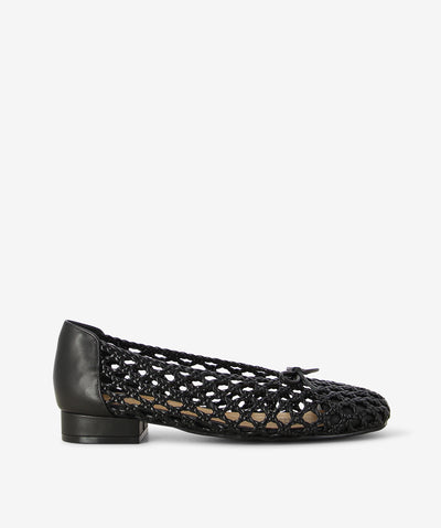 Experience Planet Black Ballet Flat by Bresley—a fusion of classic ballet charm and modern craftsmanship. With an intricate open-weave design that adds visual interest while keeping things light and airy. Interlaced black leather strips, the upper features a delicate lattice effect, complemented by a solid heel counter for added structure and support. A petite bow at the rounded toe adds a nod to traditional ballet styling, while the low stacked heel ensures comfort with every step.