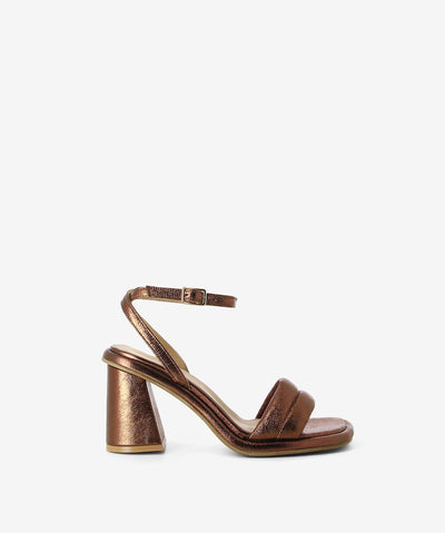 Brown metallic leather sandals by Epoche Xi. It has a wrap-around ankle pin-buckle strap and features a padded upper with block heel and a soft square toe.