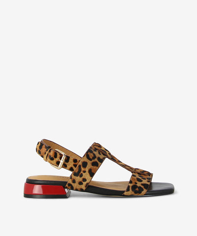 Step into bold elegance with the Santos Leopard Sandal by Bresley, designed for the modern woman who embraces confidence and style. Crafted from a textured leopard-print pony upper in rich brown and black tones, this slingback sandal effortlessly balances comfort with statement appeal. A square open-toe silhouette and adjustable gold buckle ensure a secure, flattering fit, while the low block heel provides all-day comfort without compromising on edge. 