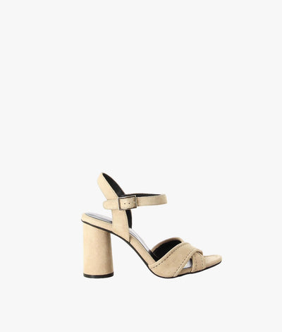 Beige suede leather sandals by Martini Marco. It has an ankle buckle strap with a features round block heel and a round toe.