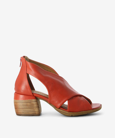 Coral leather mules by Martini Marco. It has a large cross strap upper, back zipper, and a square toe.