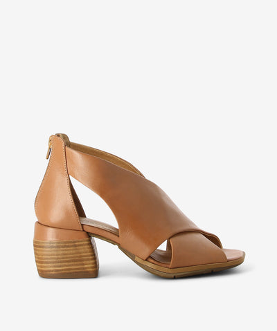 Tan leather mules by Martini Marco. It has a large cross strap upper, back zipper, and a square toe.