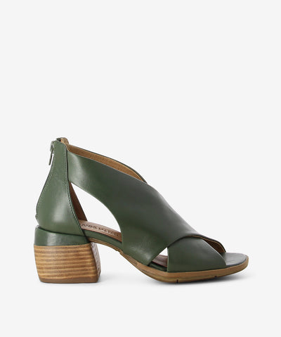 Green leather mules by Martini Marco. It has a large cross strap upper, back zipper, and a square toe.