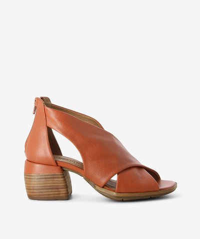 Brown leather mules by Martini Marco. It has a large cross strap upper, back zipper, and a square toe.