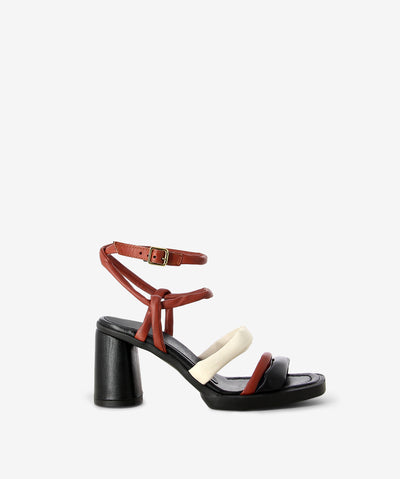 Black, red, and white heeled leather sandals by Sempre Di by Mjus. It has 3 cushioned leather straps on its upper, and features a rounded block heel and a squared toe.