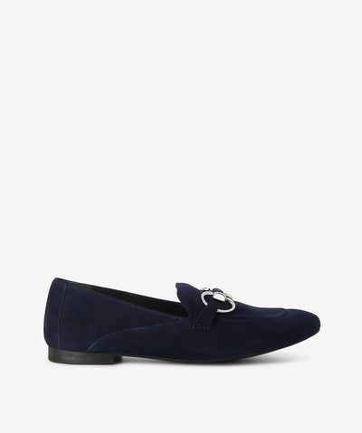 Navy suede loafers by Martini Marco. It is a slip-on style and features chain detailing, a low block heel, and a round toe.