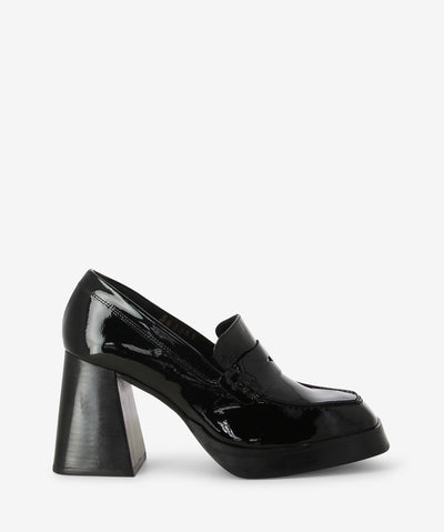 Black patent leather heeled loafers by Alohas. A slip-on style features moccasin-style pumps, a chunky flared heel and a square toe.