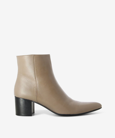 Taupe leather ankle boots by Martini Marco. It features a side zip closure, contrasting block heel, and a pointed toe.